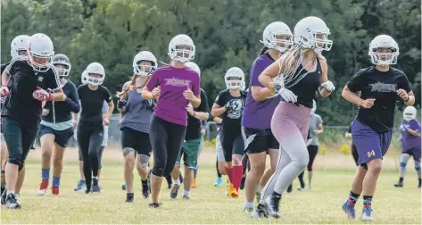  ??  ?? Tanya Dales, the Peterborou­gh Royals team manager, leads a training run at Solstice Park. Photo: Mick Sutterby