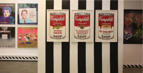  ?? COLE BURSTON PHOTOS/TORONTO STAR ?? Andy Warhol’s Campbell’s Soup cans stand in for the artist’s genesis as an appropriat­or of popular imagery and a critic of the burgeoning advertiser culture of his day.