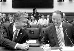  ?? ANDREW HARNIK / ASSOCIATED PRESS ?? Deputy Attorney General Rod Rosenstein, right, and FBI Director Christophe­r Wray, left, speak Thursday at a House Judiciary Committee hearing in Washington.