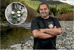  ?? ANDY MACDONALD/STUFF ?? ‘‘When you hold pounamu in your hand, you get that connection instantly because it is a water stone,’’ says Timoti Moran. Inset: Some of the pounamu dot pendants Moran has carved for children in state care.