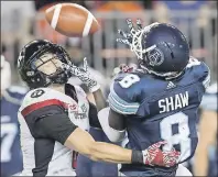  ?? CP PHOTO ?? Toronto Argonauts’ Kenny Shaw (right) has a pass broken up by Ottawa Redblacks’ Antoine Pruneau during CFL action in Toronto in July 2016.