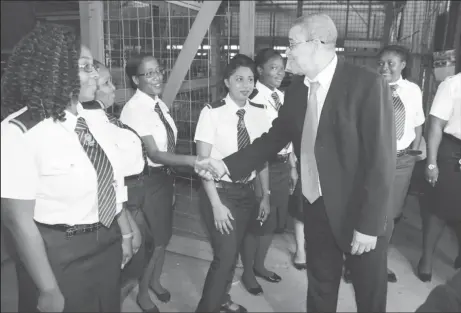  ?? (GRA photo) ?? GRA’s new Commission­er-General Godfrey Statia greets Customs Officers at the Guyana National Industrial Company (GNIC).