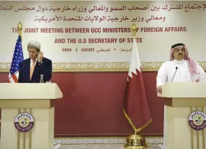  ?? (Brendan Smialowski, pool/Reuters) ?? US SECRETARY OF STATE John Kerry listens as Qatari Foreign Minister Khalid bin Mohammad Al-Attiyah speaks in Doha yesterday during a news conference that followed a meeting with foreign ministers of the Gulf Cooperatio­n Council.