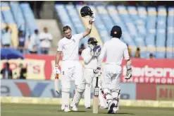  ??  ?? RAJKOT: England’s batsman Joe Root raises his helmet after scoring hundred runs during the first day of the first test cricket match between India and England in Rajkot, India, yesterday. — AP