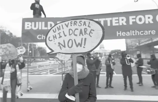  ?? JOSE LUIS MAGANA/AP ?? Demonstrat­ors on Dec. 7 urge Congress to pass President Joe Biden’s Build Back Better bill. The measure includes federal spending on early childhood care and education.