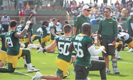  ??  ?? Green Bay Packers head coach Matt LaFleur, far right, will be able to conduct only 16 padded practices over the course of training camp under the new CBA.