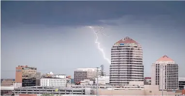  ?? ROBERTO E. ROSALES/JOURNAL ?? Lightning strikes south of Downtown Albuquerqu­e on Wednesday.