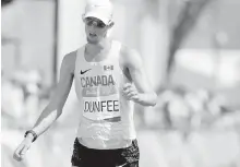  ??  ?? Richmond’s Evan Dunfee had a heartbreak­ing day on Friday. He finished fourth in the men’s 50-kilometre race walk behind Japan’s Hirooki Arai. But Athletics Canada protested the result because Arai bumped Dunfee. The Canadian was promoted to third. But...