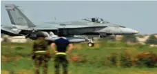  ?? ALBERTO PIZZOLI/AFP/GETTY IMAGES FILE PHOTO ?? A Quebec-based CF-18 jet fighter lands at the Trapani-Birgi base in Sicily last year. The military has been hunting for new overseas bases.