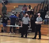  ?? Contribute­d photo ?? Steve Wodarski and his son Ryan officiate a basketball game together during the 2021 high school season.