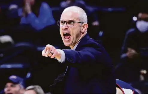  ?? Derik Hamilton / Associated Press ?? UConn coach Dan Hurley calls out to his team during a against Villanova on Feb. 5 in Philadelph­ia. Wildcats’ coach Jay Wright retired earlier this week and Hurley hopes to one day achieve the same success as the Hall of Fame coach with the Huskies.