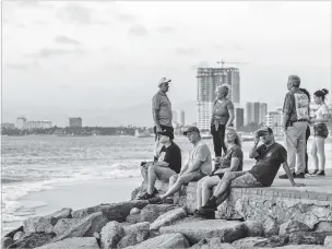  ?? ALEJANDRO CEGARRA/THE NEW YORK TIMES ?? Tourists in Puerto Vallarta, a popular beach town in Mexico, on Feb. 20. Over the last five years, American timeshare owners were bilked out of $288 million, according to the FBI.