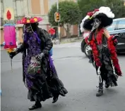  ?? EDGARD GARRIDO ?? In Mexico City, the Day of the Dead parade combines Mexican and American traditions.