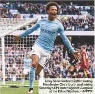  ??  ?? Leroy Sane celebrates after scoring Manchester City’s fourth goal during Saturday’s EPL match against Liverpool at the Etihad Stadium. – AFPPIX