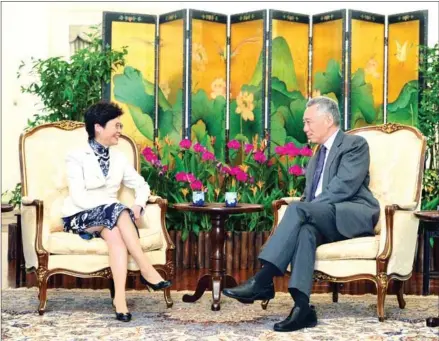  ?? ROSLAN RAHMAN/AFP ?? Hong Kong’s Chief Executive Carrie Lam (left) chats with Singaporea­n Prime Minister Lee Hsien Loong during a call at Istana presidenti­al palace on in Singapore in 2017.