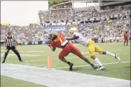  ?? Phelan M. Ebenhack / Associated Press ?? Notre Dame defensive back TaRiq Bracy breaks up a pass intended for Iowa State receiver La’Michael Pettway during the first half of the Camping World Bowl on Saturday in Orlando, Fla.