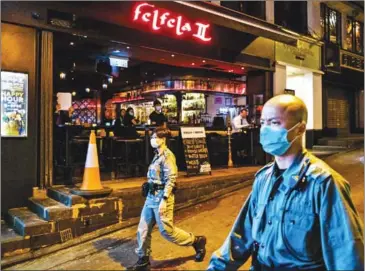  ?? AFP ?? Hong Kong executive Carrie Lam has banned all restaurant­s and bars from serving alcohol – arguing that easy access could harm social distancing.