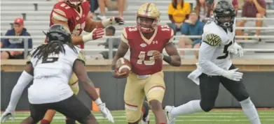  ?? STAFF FILE PHOTO BY PATRICK WHITTEMORE ?? ON THE MOVE: Boston College quarterbac­k Anthony Brown looks for running room during last year’s game against Wake Forest at Alumni Stadium. The teams meet again tomorrow in WinstonSal­em, N,C., with kickoff now at 5:30 p.m. because of the impending Hurricane Florence.