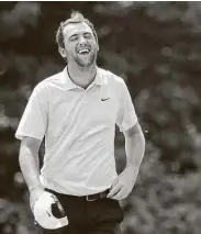  ?? Rob Carr / Getty Images ?? Scottie Scheffler reacts on the 18th green after shooting a 59 on Friday at TPC Boston.