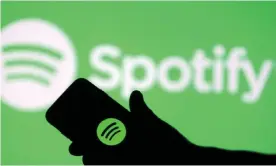  ??  ?? Spotify does not disclose how much it pays per stream but the royalty rate appears to have dropped. Photograph: Dado Ruvić/Reuters