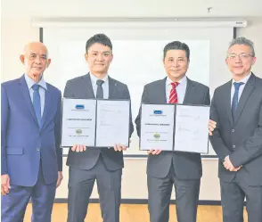  ?? ?? (From left) Zantat deputy chairman Chan Hup Ooi, Ivan, Tan and M&A Securities head of corporate finance Gary Ting during the underwriti­ng agreement signing yesterday.