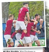  ?? ?? At the double Alan Docherty is mobbed after firing home his second goal