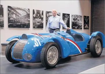  ?? Myung J. Chun
Los Angeles Times ?? PETER MULLIN, owner of the Mullin Automotive Museum in Oxnard, with his 1937 Delahaye 145. On Aug. 27, 1937, French driver Rene Dreyfus set a world speed record with one of the 12-cylinder race cars.