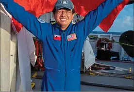  ??  ?? PROUD MOMENT: Ying-Tsong Lin holds up the Taiwan flag after his voyage