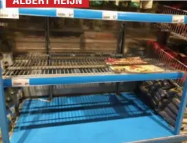  ?? FOTO RR ?? Onder meer bij Albert Heijn in Hasselt waren de rekken met frituuroli­e gisteren volledig leeg.