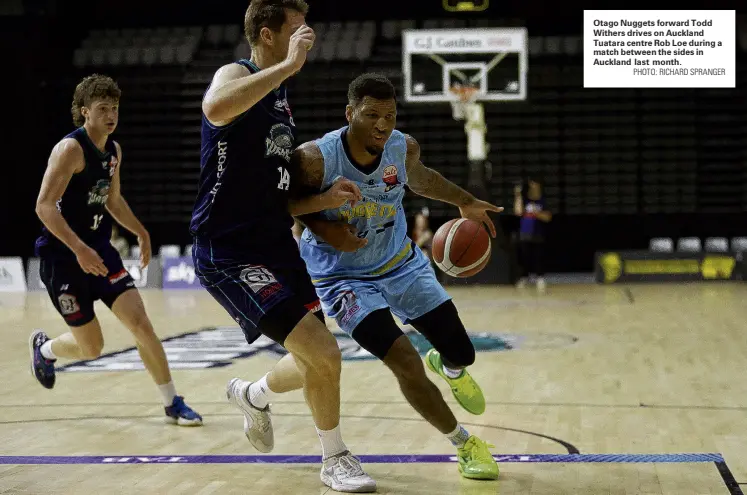  ?? PHOTO: RICHARD SPRANGER ?? Otago Nuggets forward Todd Withers drives on Auckland Tuatara centre Rob Loe during a match between the sides in Auckland last month.