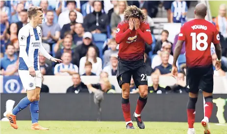  ?? AP ?? Manchester United’s Marouane Fellaini (centre) and Ashley Young (right) react to a decision favouring Brighton &amp; Hove Albion during the teams’ English Premier League match at the Amex stadium in Brighton, England, yesterday.