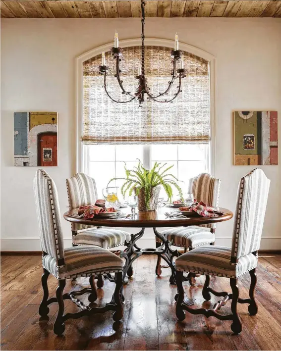  ?? Julie Soefer ?? Varied textures in upholstery, furniture, lighting and window treatments combine in this breakfast room, which is featured in “Expressive Interiors.”