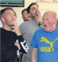  ??  ?? Agony for fans at the ground and in the Snug Bar, Main Street, Dundee.