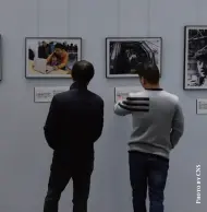  ??  ?? Visitors view a photo exhibition at the
Chongqing Library for the 40th anniversar­y of the Establishm­ent of Sino-us Diplomatic Relations held by the US Consulate General in Chengdu, Sichuan Province and the Chongqing Library, November 22, 2019