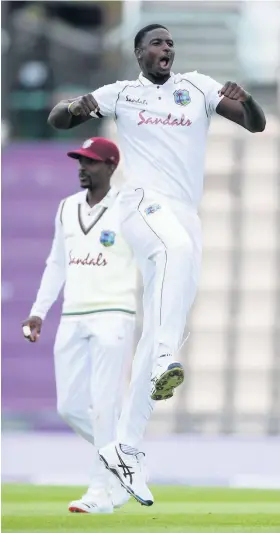  ?? Picture: Mike Hewitt/Getty ?? West Indies captain Jason Holder celebrates after dismissing England’s Jos Buttler at the Ageas Bowl