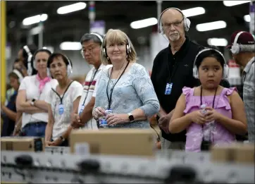  ?? ANDA CHU — STAFF PHOTOGRAPH­ER ?? Families were among the visitors who toured an Amazon center in Sacramento last month.