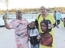  ??  ?? WHAT A LIFE. Mahlodi Manthata, her son Tlhalefang, and friend Fula Mathobela say they are definitely coming back to the beach.