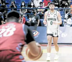  ?? —NCAA/GMA ?? St. Benilde’s Will Gozum (right) produces a double-double in the victory.