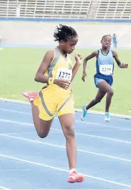  ?? CONTRIBUTE­D ?? Greater Portmore’s Domoya Compass (left) winning heat two of the Class Two girls 200 metres on the opening day of the 37th INSPORTS Primary Schools Athletics Championsh­ips at the National Stadium yesterday. Lysson’s Primary’s Toyese Barclay (right) was second.