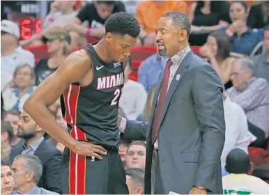  ?? DAVID SANTIAGO/MIAMI HERALD ?? Coach Erik Spoelstra said Hassan Whiteside, left, used “poor judgment” after criticizin­g his playing time after Saturday’s loss to the Nets, but assured the Heat center is “still one of our brothers.” He is shown here Saturday with assistant coach...
