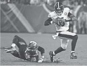  ?? CHRISTOPHE­R HANEWINCKE­L/USA TODAY SPORTS ?? Quarterbac­k Joshua Dobbs scrambles in last year’s preseason with the Steelers before he was traded to Jacksonvil­le.