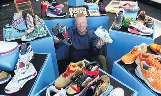  ?? PHOTO: SHARON REECE ?? Well heeled . . . Collector Kevin Downie surrounded by some of his favourite shoes at Classic Motorcycle Mecca in Invercargi­ll yesterday.