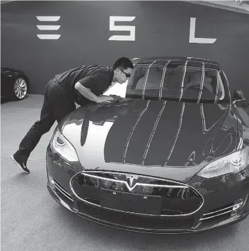  ?? NG HAN GUAN / THE ASSOCIATED PRESS ?? Tesla said last month it had delivered 10,030 Model S sedans in the first quarter, a 55 per cent
increase from the year before.