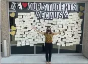  ??  ?? Butte College President Samia Yaqub poses in front of a sign with notes from teachers to students on the first day of school in Oroville.