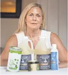  ?? DAX MELMER/WINDSOR STAR ?? Diane Pineault, owner of Healthy Connection­s in Windsor, Ontario, uses a variety of massage oils and candles she imports from the U.S. for her business. The products face a 10 percent tariff because of trade tensions.