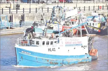  ??  ?? Fishing boats take part in a demonstrat­ion on the River Tyne in Newcastle, northeast England, against the terms of the current Brexit deal being offered by May. — AFP photo