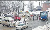  ?? ANI ?? Vehicles passing through as national highway opens for one-way traffic in Srinagar on Sunday.