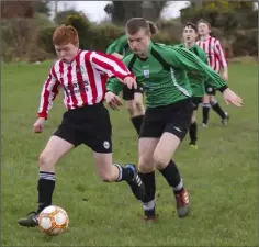  ??  ?? Gary Porter of Shelburne breaks away from Enniscorth­y Town’s Keane Byrne.