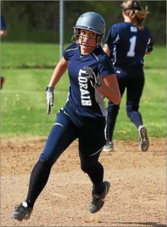  ?? RANDY MEYERS — THE MORNING JOURNAL ?? Lorain’s Raegan Osko rounds second base and heads for third against Magnificat.