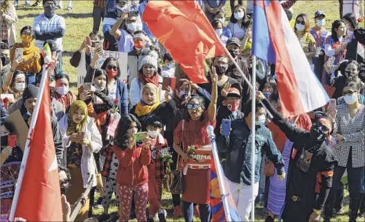  ?? Photos by Paul Buckowski / Times Union ?? Supporters of people in Myanmar, formerly Burma, who are fighting against a recent military coup, gathered Sunday in Albany’s Lincoln Park for a rally. They honored the fallen and called for internatio­nal help to restore democracy.